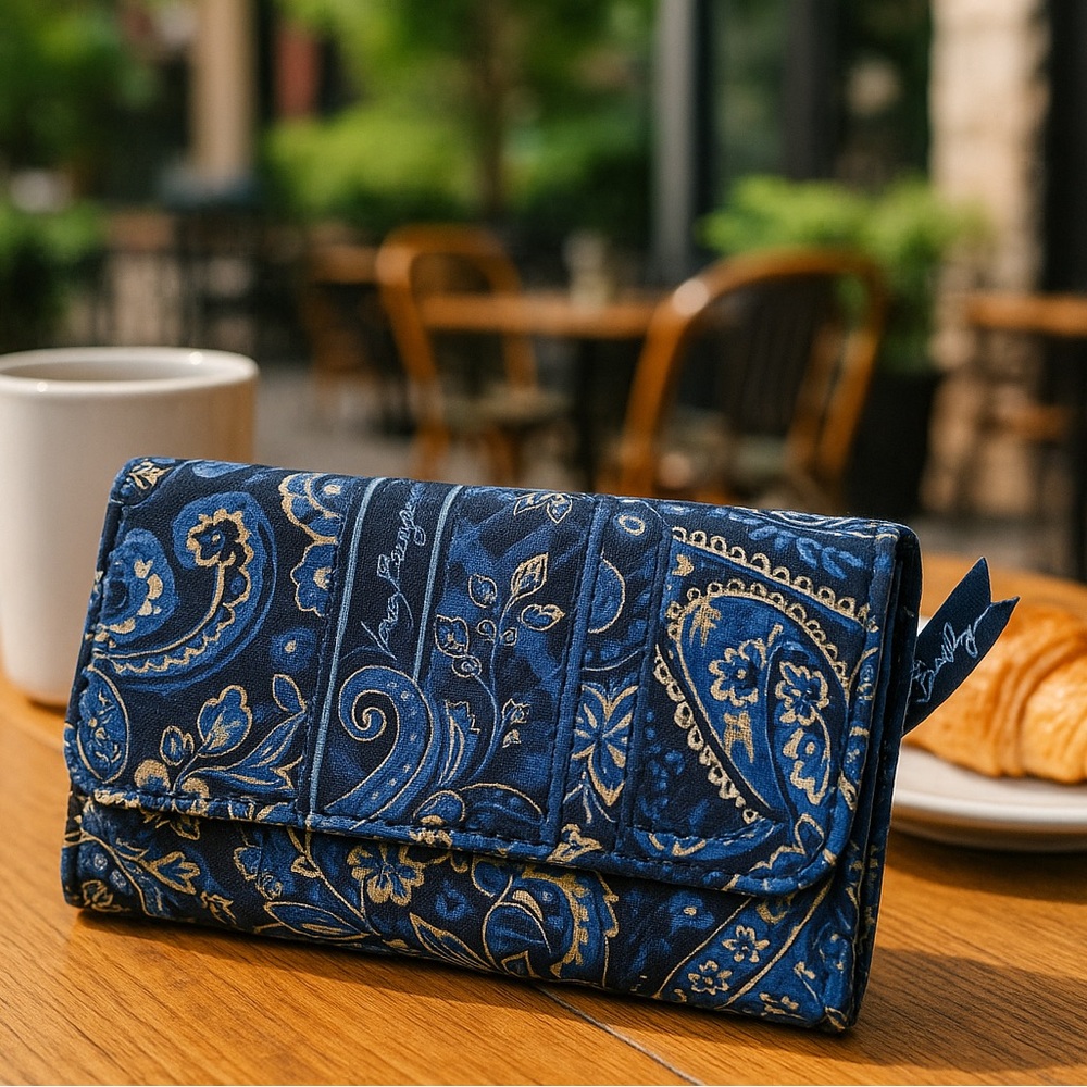 Blue Paisley/Floral Wallet on a strap from Vera Bradley.  GUC. 9" x 5"